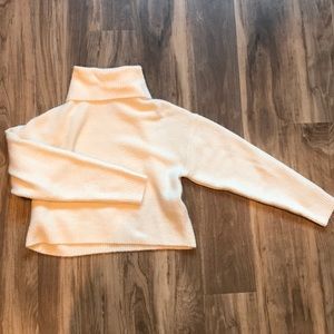 Cream cropped turtleneck sweater